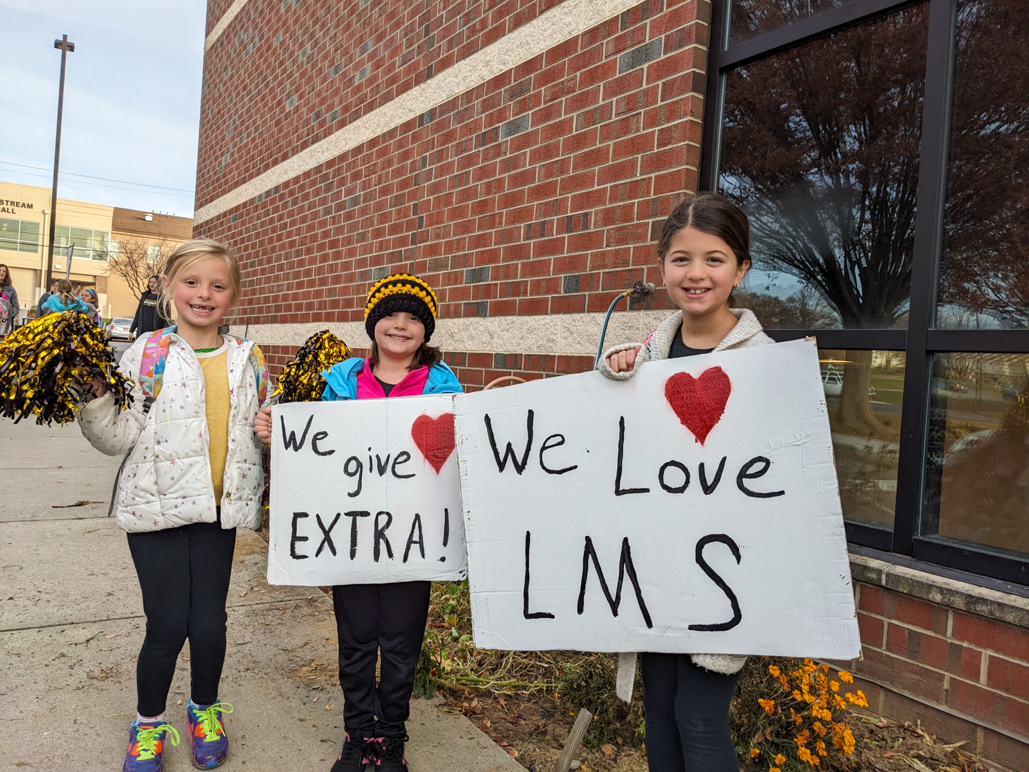 3 elementary students during morning drop off