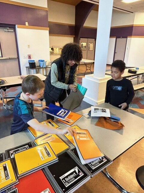 LM students packing school kits