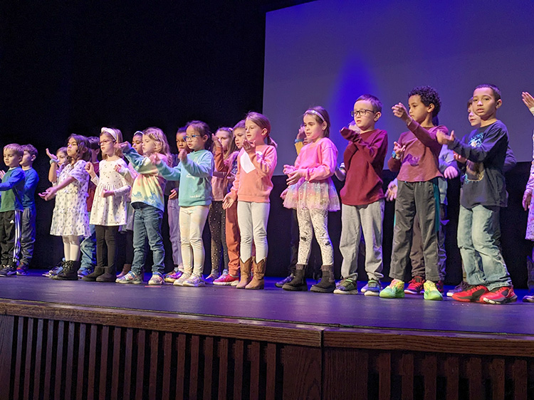 Elementary students singing at Grandparents Day