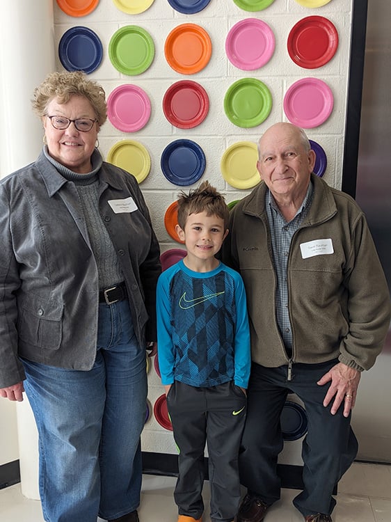 LM student with their grandparents.