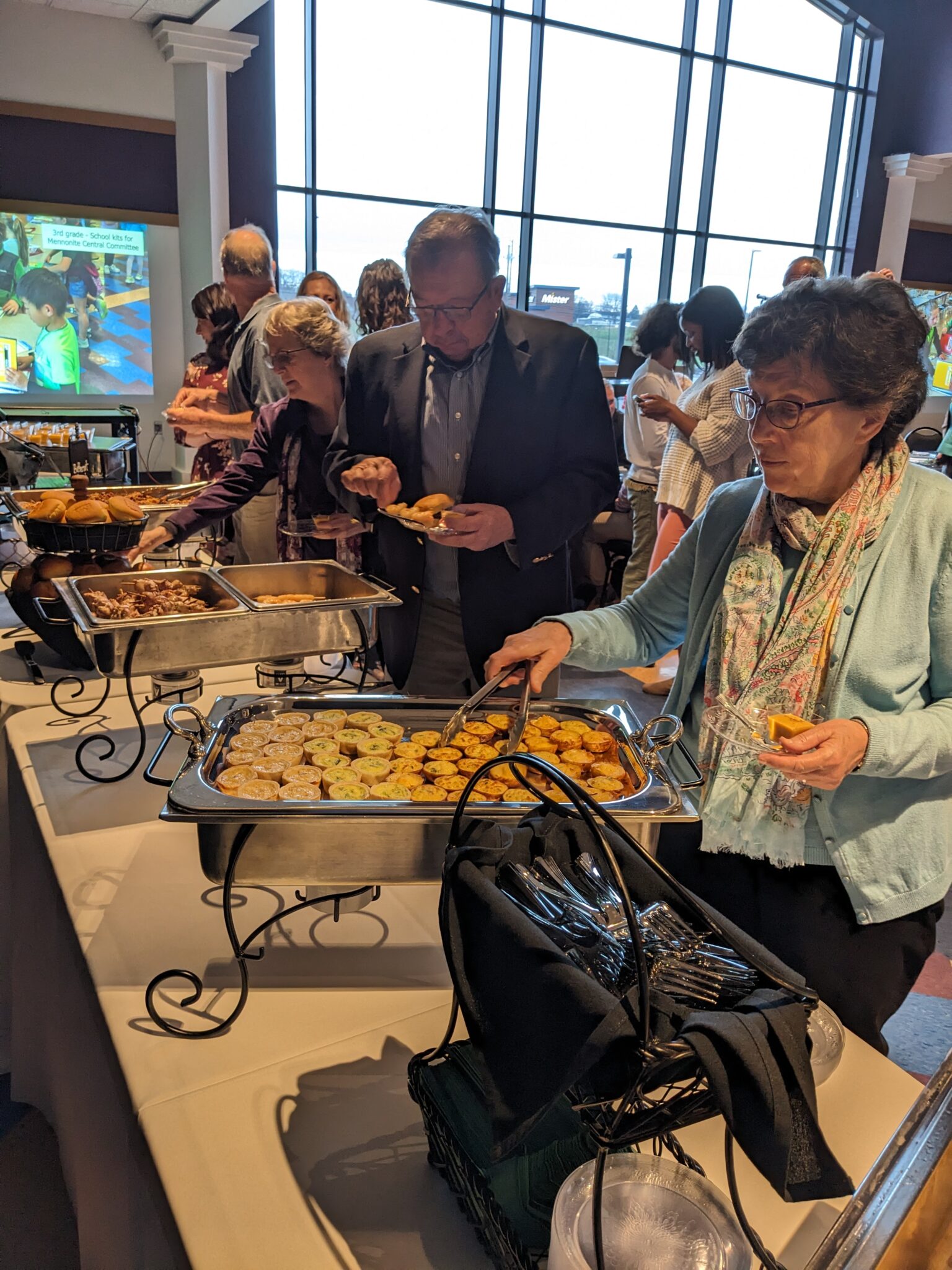 Gala attendees getting food.