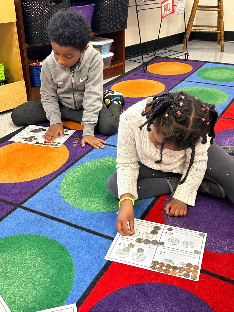 students counting coins