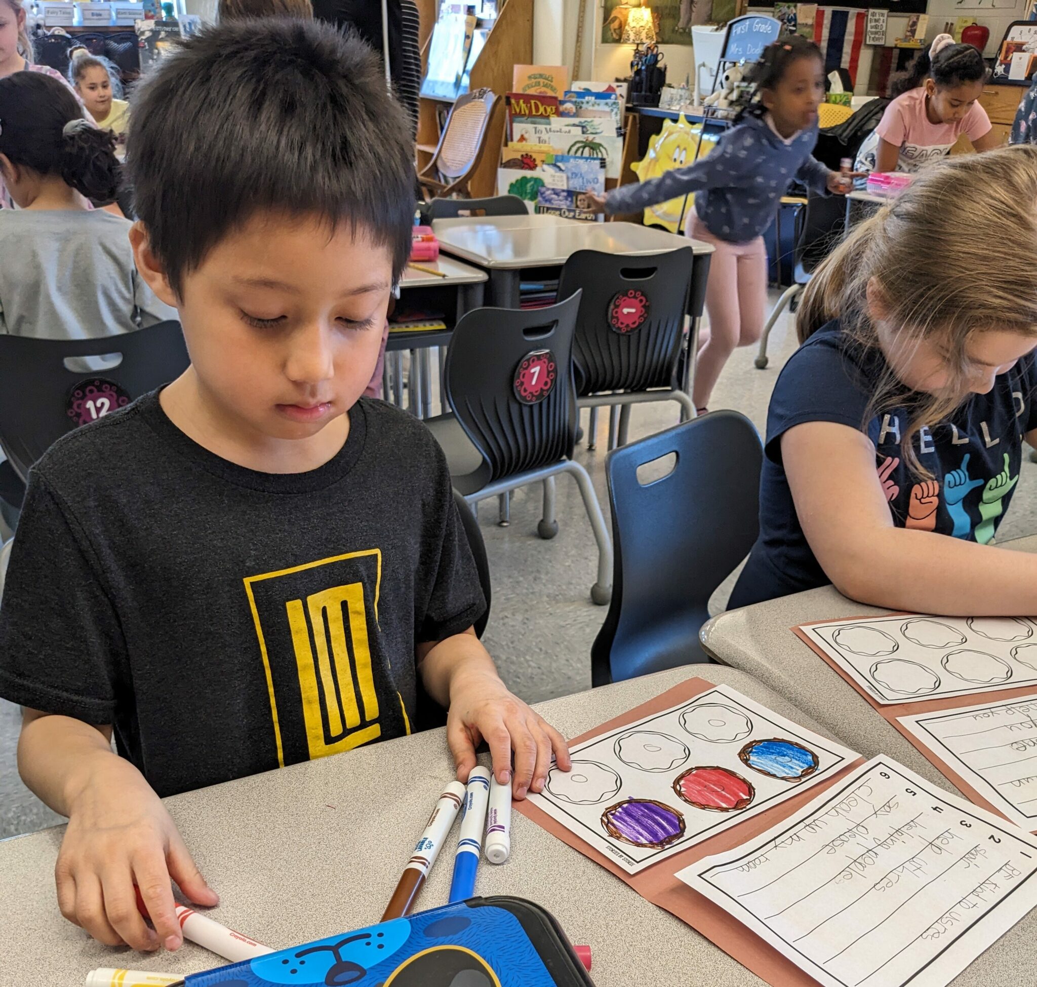 Elementary students creating Kindness Donuts.