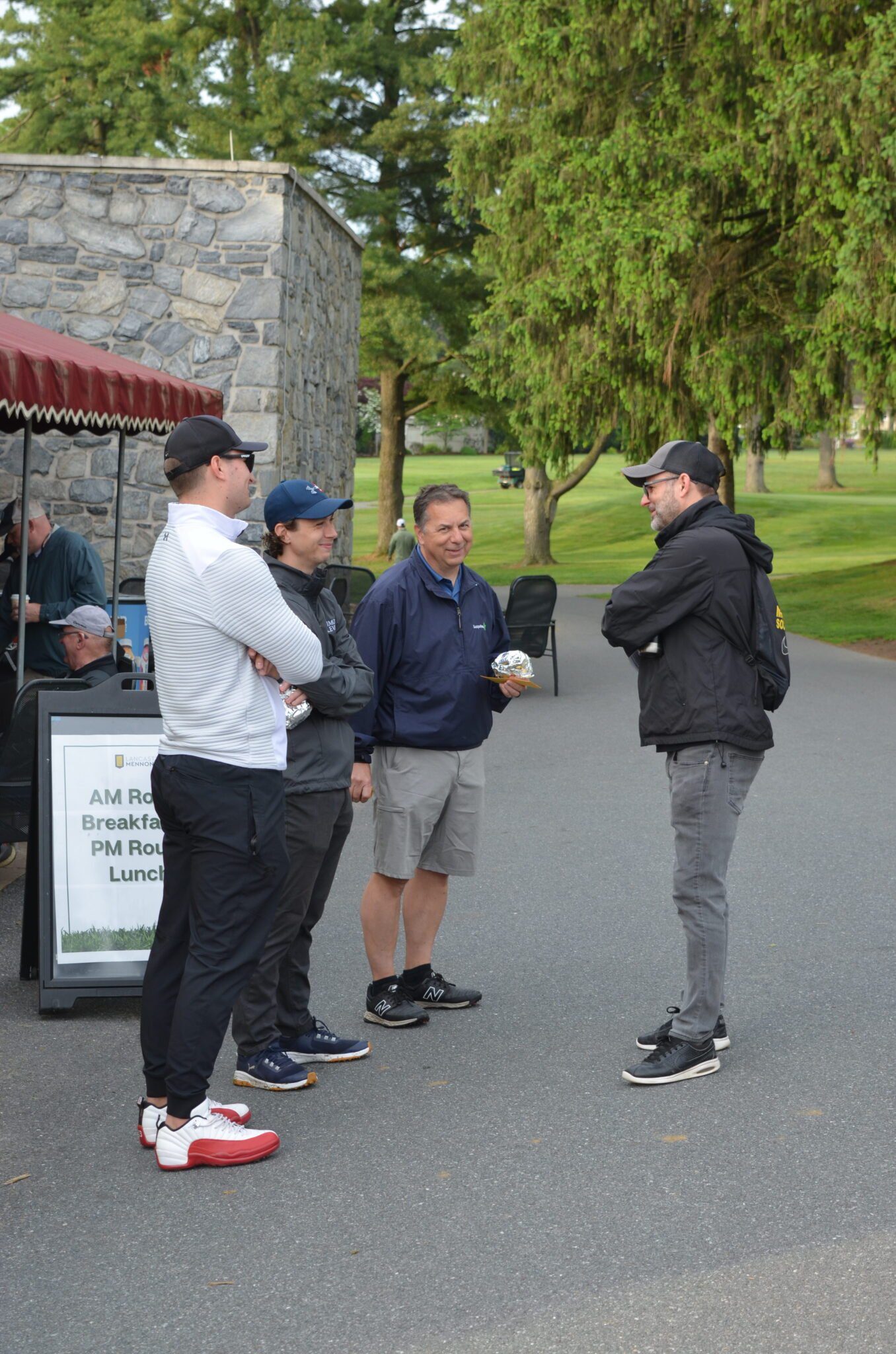 Golf tournament attendees talking