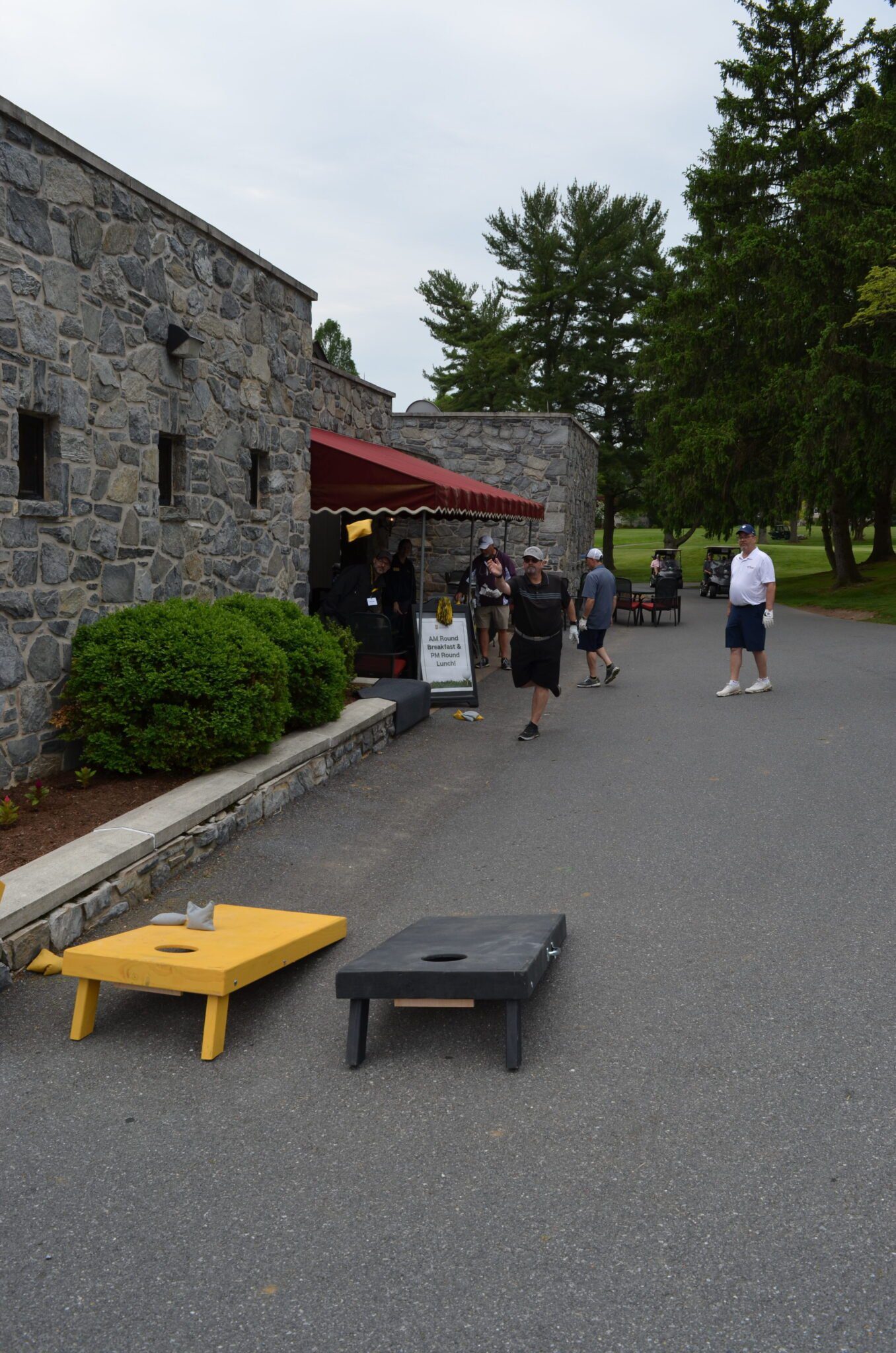 people playing cornhole