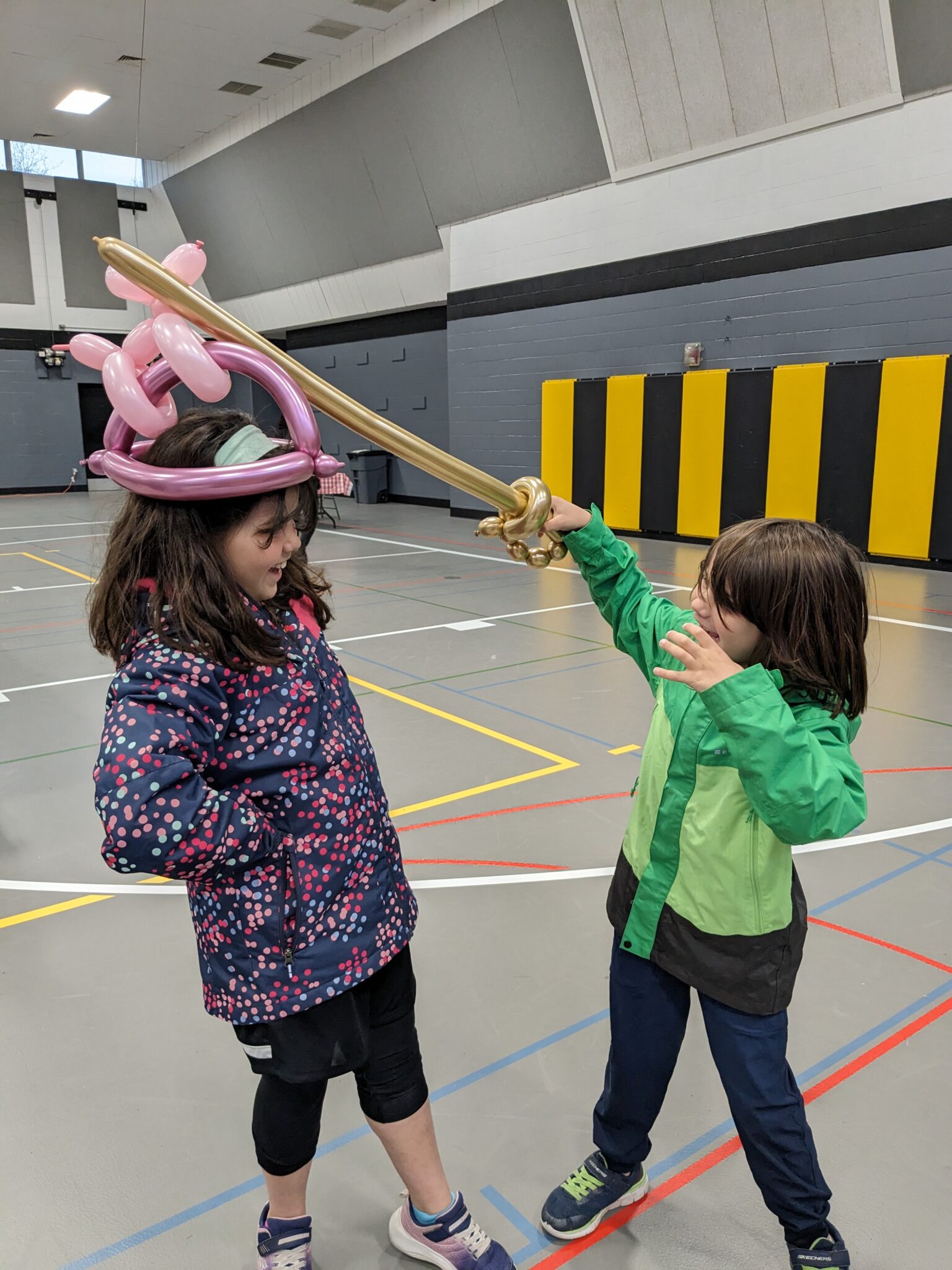 two students with balloons