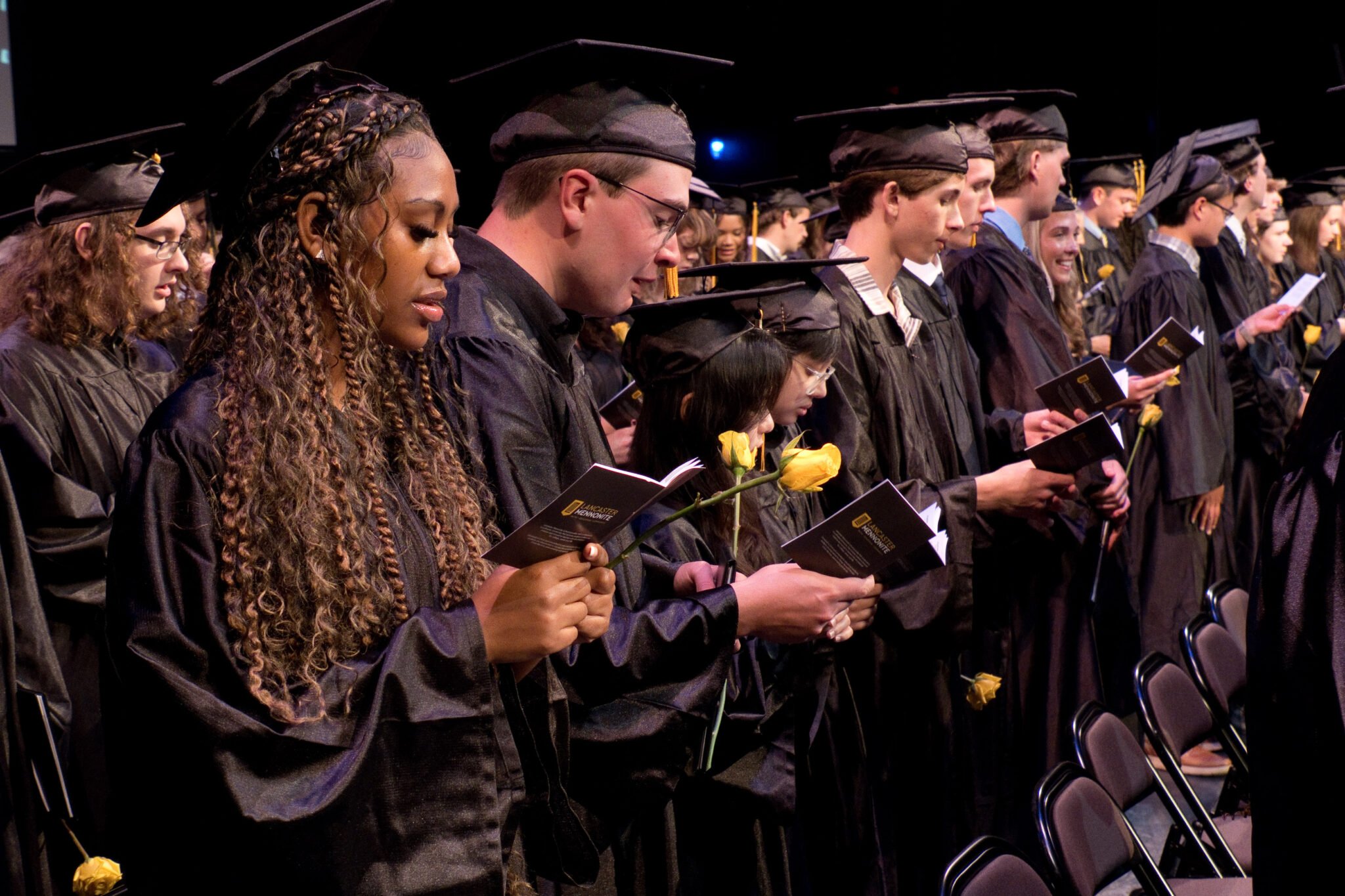 Students standing at Graduation