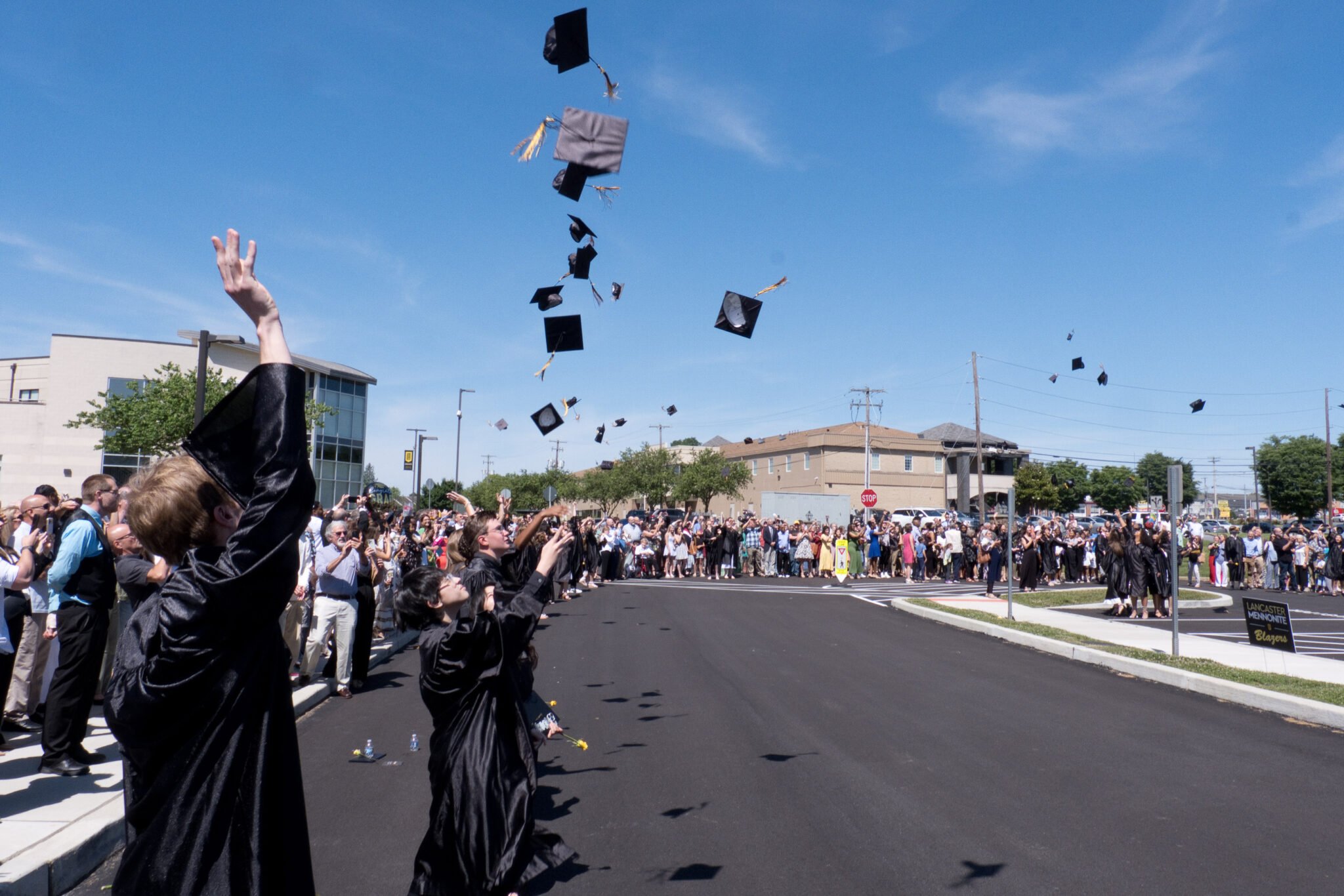 Students tossing their caps