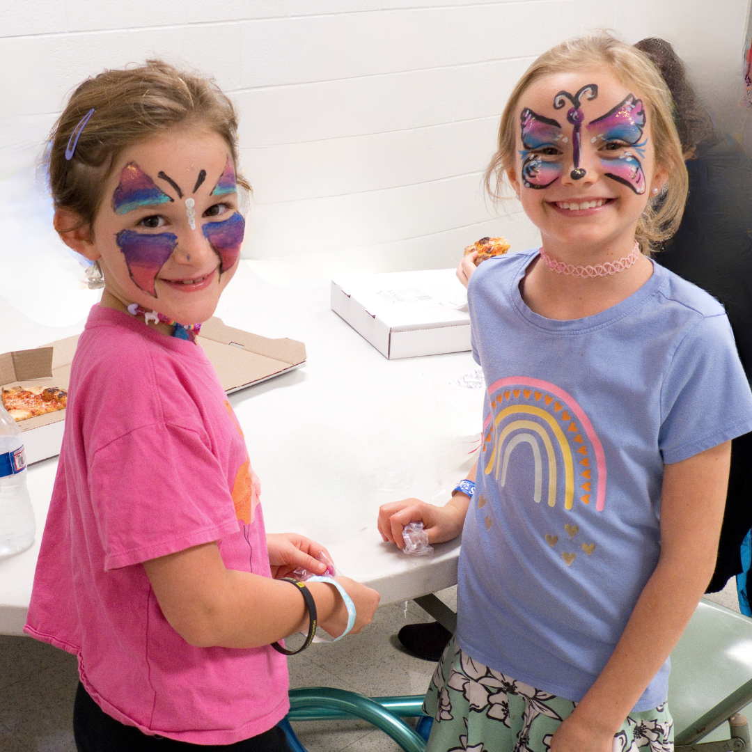 two girls with their faces painted