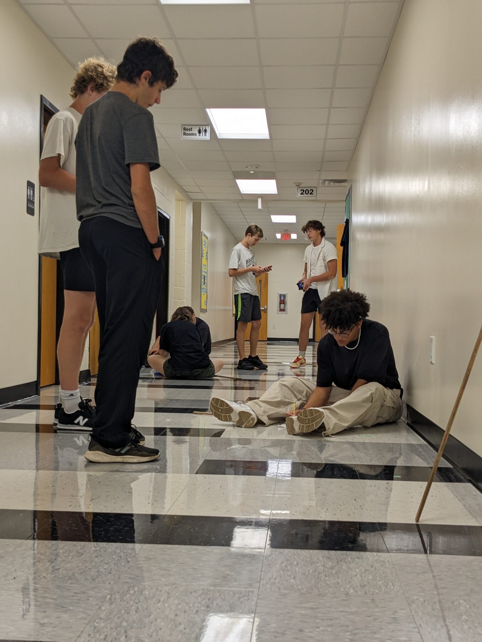 Students sitting in the hallway