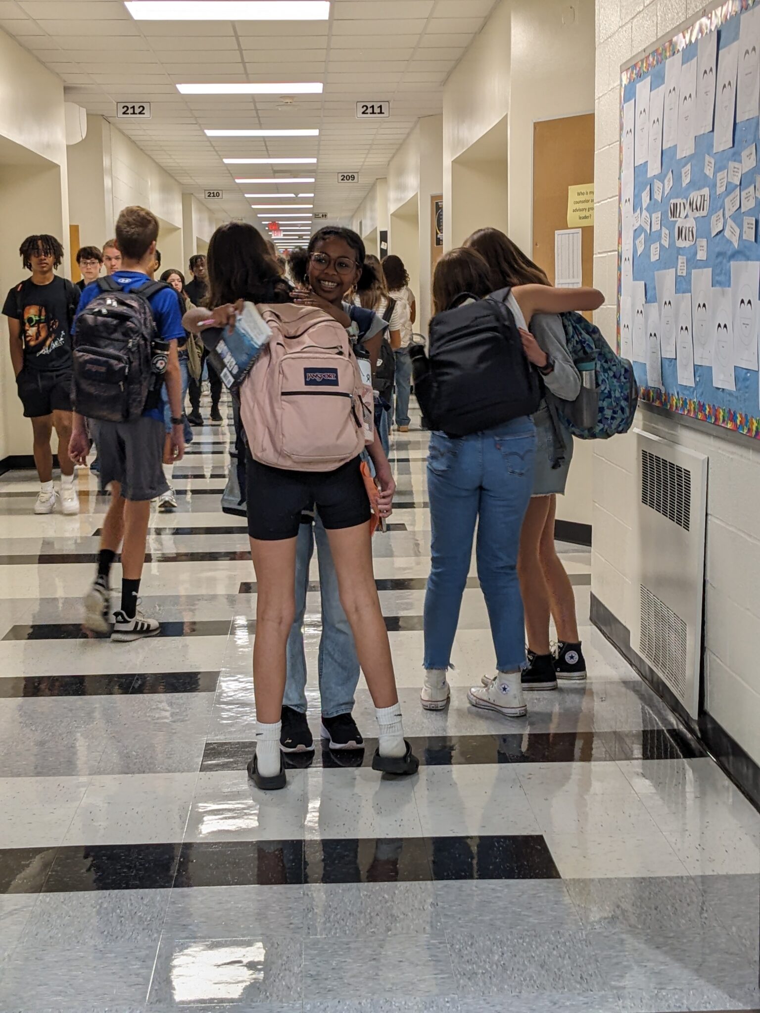 Students greeting each other in the hallway