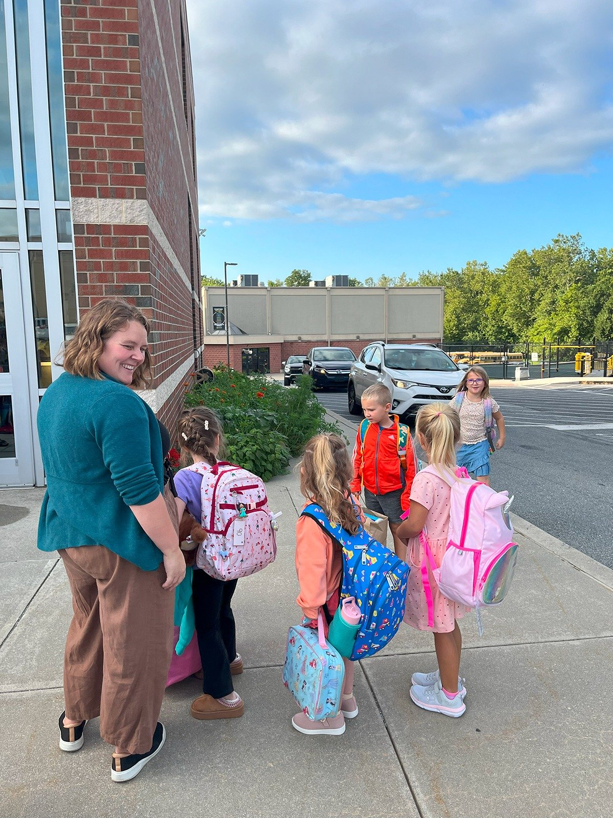 Elementary students arriving at school