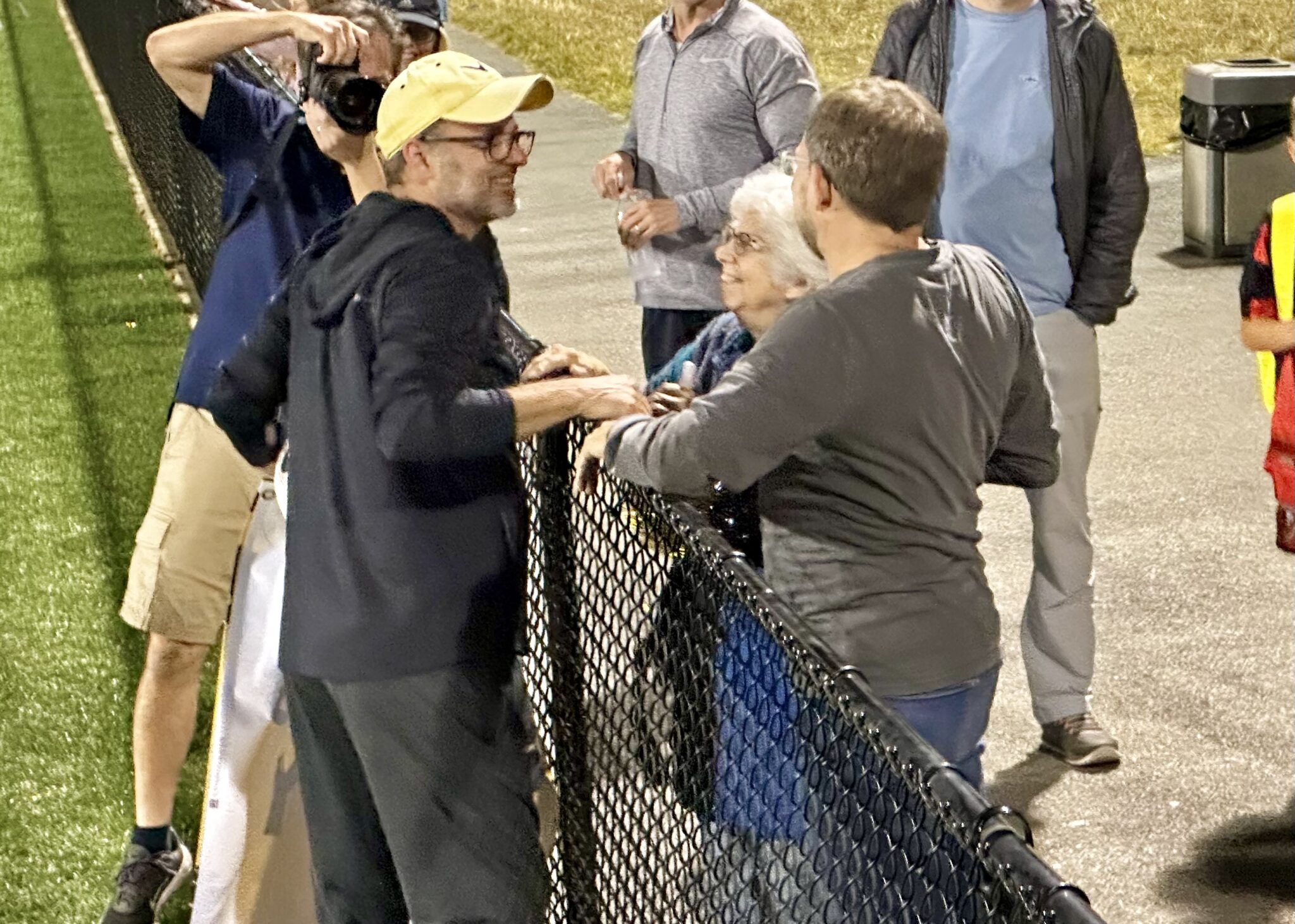Mr. Winey talking to spectators