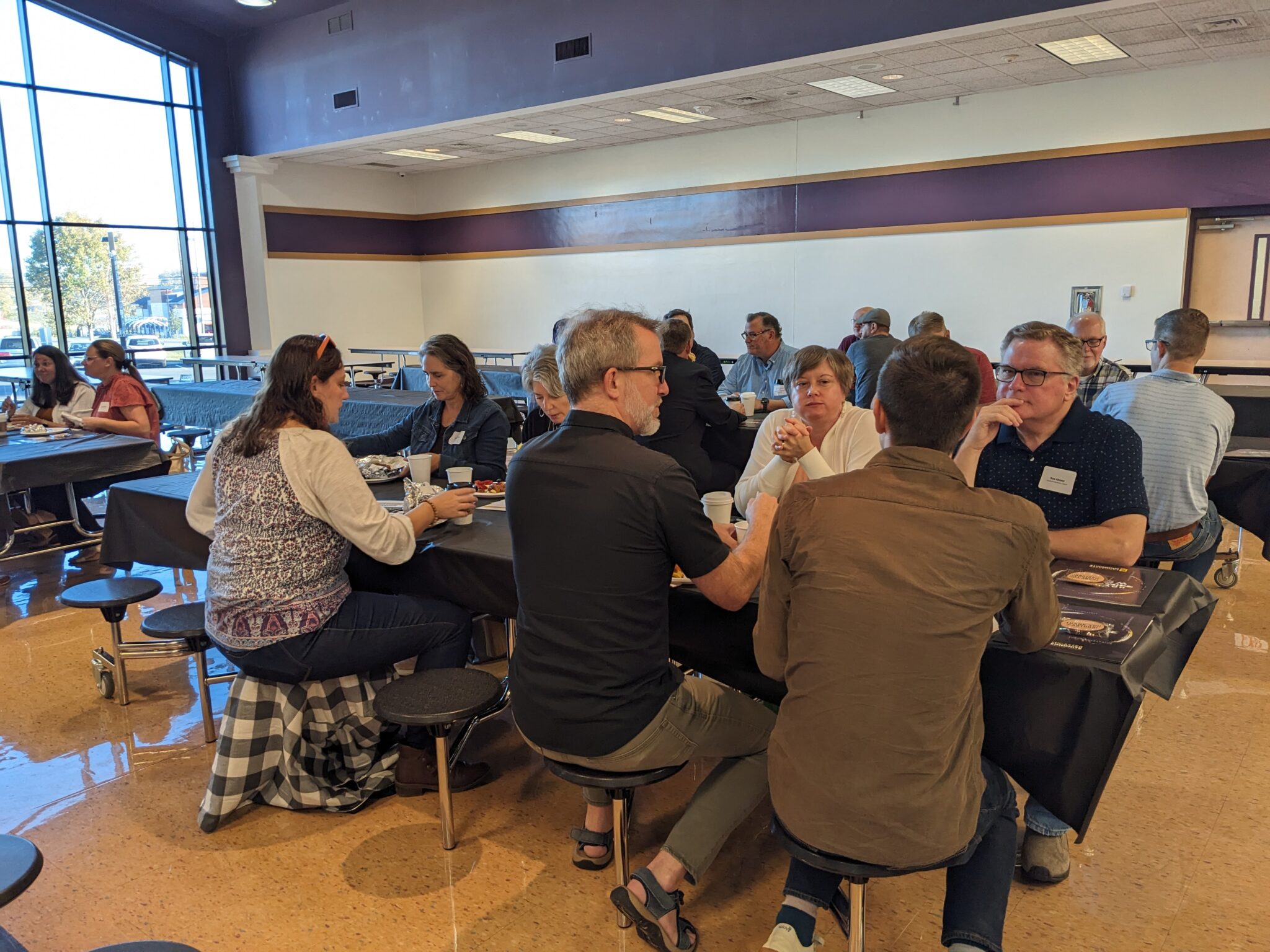 Pastors sitting at a table talking