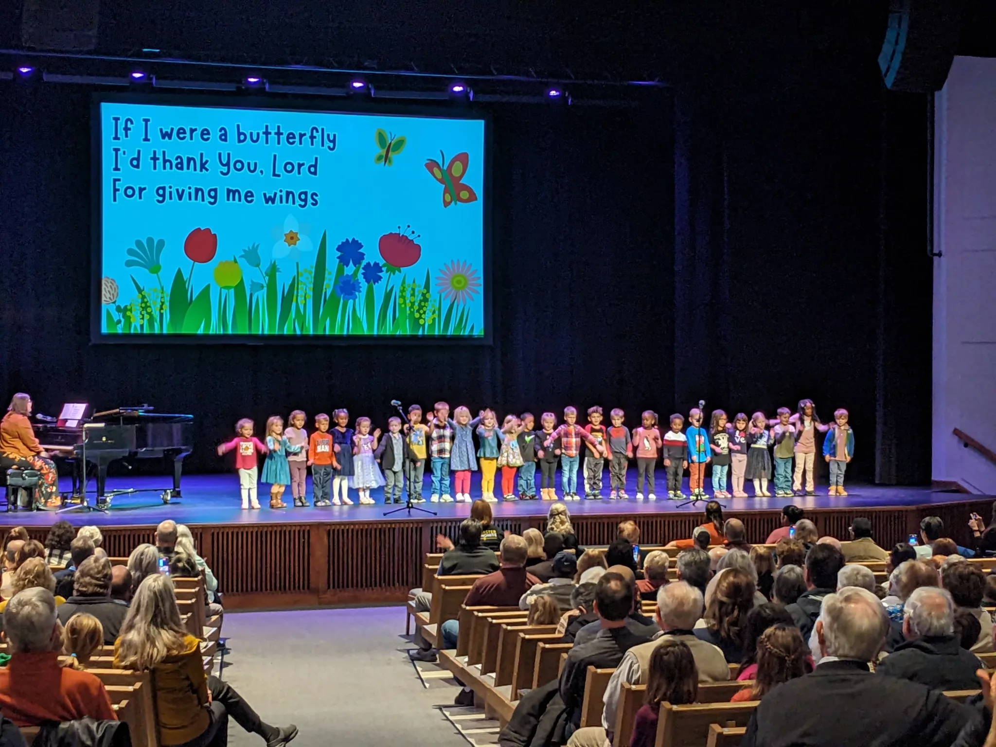 Students singing in Chapel during Grandparents Day