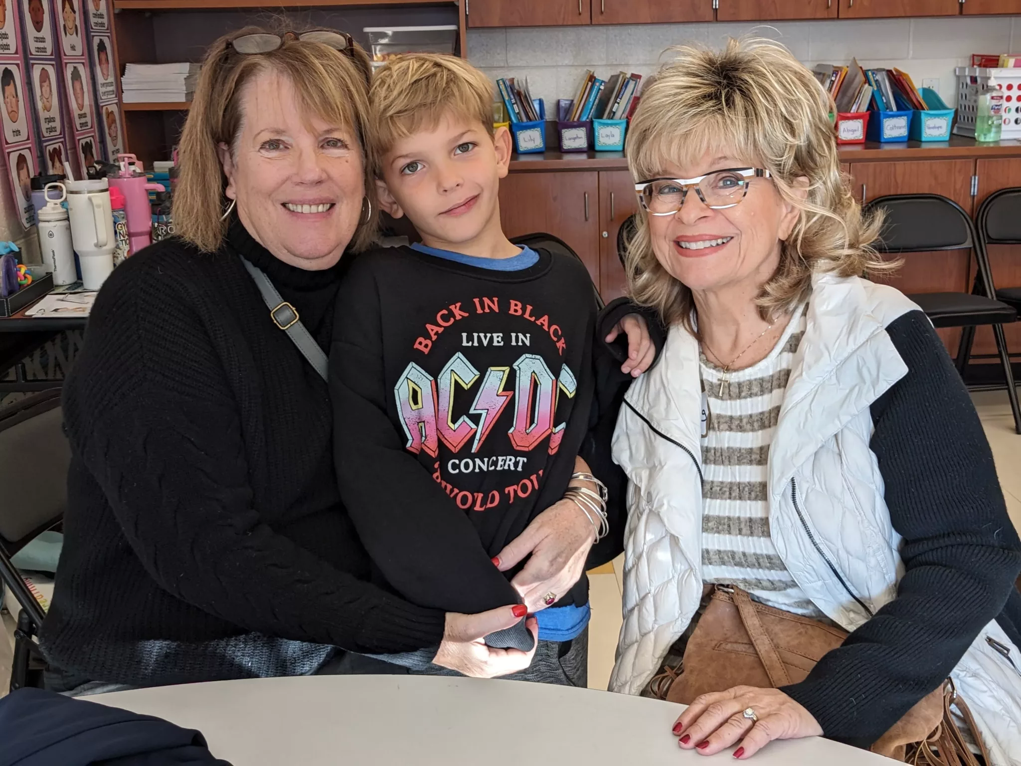 Student with grandparents at Grandparents Day