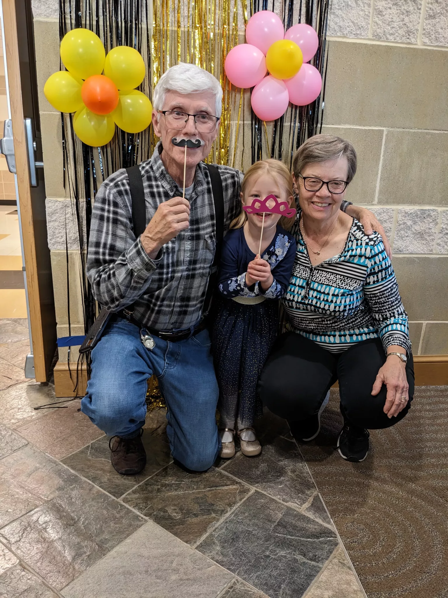 Student with grandparents at Grandparents Day