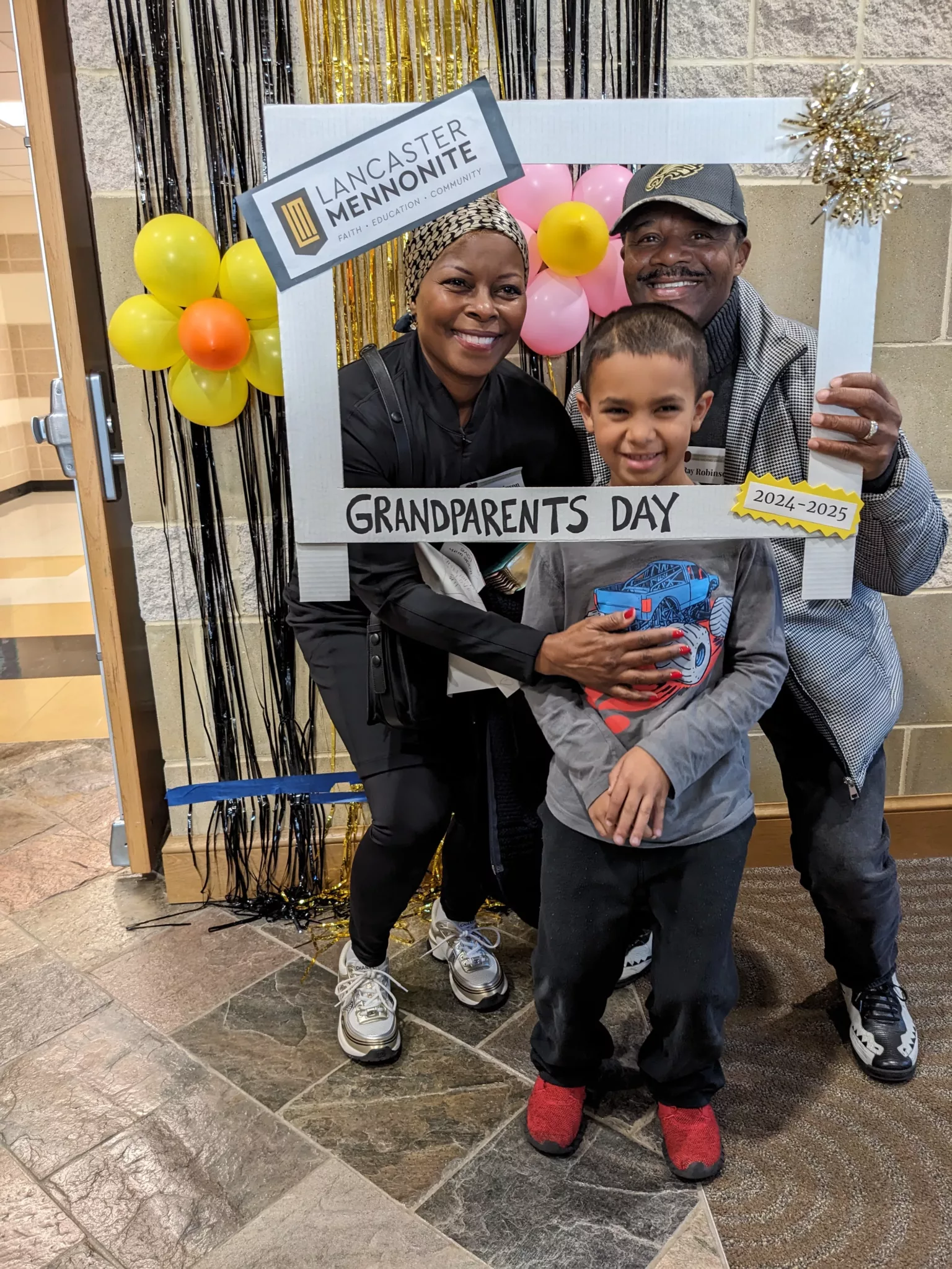 Student with grandparents at Grandparents Day