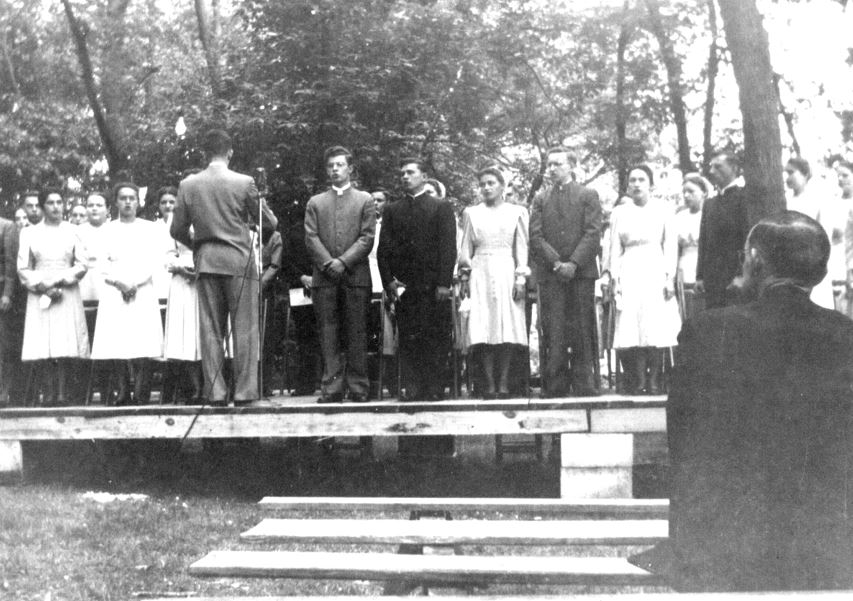 Leading the 1948 Class song